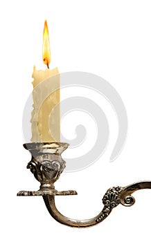 Burning old candle vintage bronze Silver candlestick. Isolated On White Background.