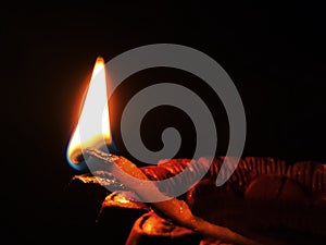 A burning Oli lamp photo
