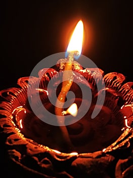 A burning Oli lamp photo