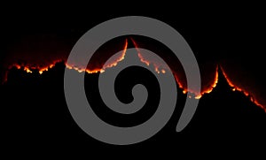 burning paper, glowing edge of paper on a black background.