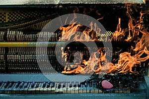 Burning piano, musical style, grunge instrument.