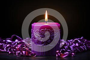 Burning purple candles with ribbons on wooden table, closeup