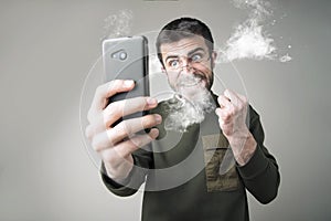 Burning with rage with his phone