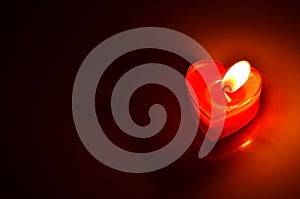 Burning red candle heart