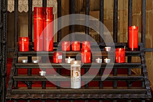 Burning red candles in a church, venice, italy