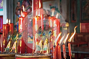 Burning red candles in Thai Temple, Thailand