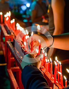 Burning red chinese candle in temple