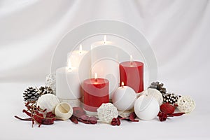 Burning red and white Christmas candles background