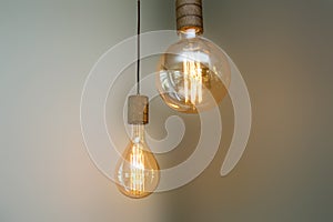 Burning retro light bulb on blurred background colorful vintage design