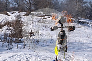 Burning scarecrow on festival maslenitsa. Slavic national spring pagan festival - Maslenitsa.