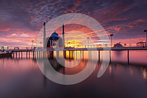 Burning sky at Losari Beach with 2 mosques on frame