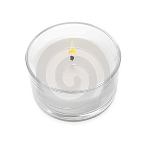 Burning small wax candle in glass holder isolated on white