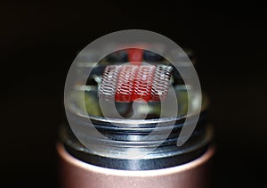 Burning staple staggered fused clapton coil in rebuildable dripping atomizer