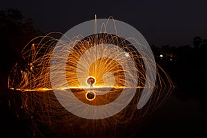 Burning steel wool night long exposure. Detailed Casting fire flare steel wool