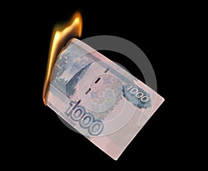 Burning thousand rubles photo