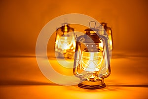 Burning three kerosene lamps background