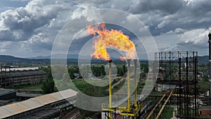 Burning a torch at a chemical plant. Emission of harmful substances into the atmosphere Chimney With Fire in chemical