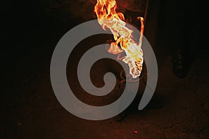 burning torch with flames, amazing fire show at night at festival or wedding party. fire show performance and entertainment. Fire