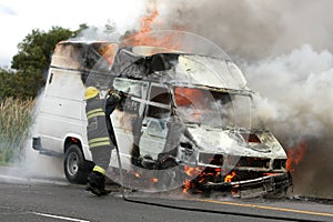 Burning Vehicle and Fireman
