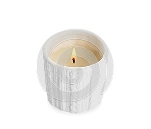 Burning wax candle in holder on white background