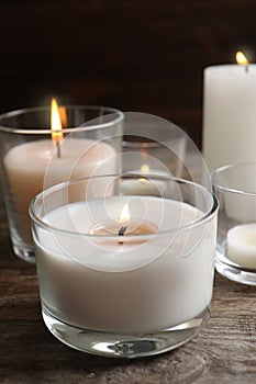 Burning wax candles in glasses