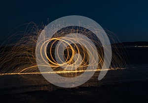 Burning wire wool image, light trails