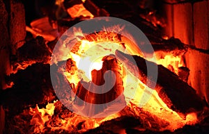 Burning wood and fire in the fireplace