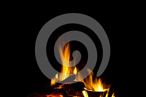 Burning wood logs in the fireplace close up. Barbeque fire. Charcoal and burning wood background. Fire background texture.