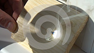 Burning on the wood pattern . with the help of magnifying glass burns on a wooden board . sunbeam tree burns. draws with