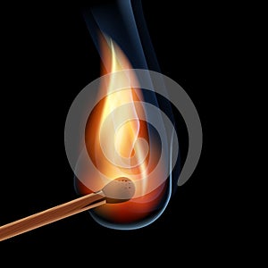 Burning wooden match on a black background