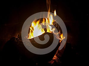 Burning woods in a cosy fire plade in winter