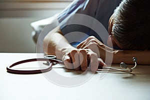 A burnout doctor feeling tired in medical office