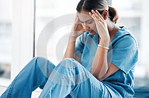 Burnout, stress and medical with nurse on floor of hospital for sad, mental health and headache. Anxiety, depression and