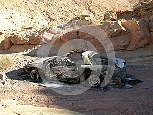 Burnt and abandoned car in a desert canyon near Las Vegas, Nevada.