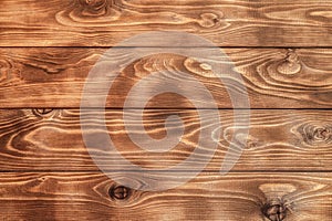 Burnt brown wood planks close-up for background photo