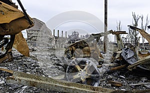 Burnt cars and destroyed buildings of the workshop of the Azovstal plant in Mariupol