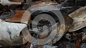 Burnt and damaged cars of civilians as a result of a military attack on Ukraine.