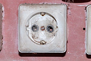 Burnt electric power socket. 220 V overloaded phase cable