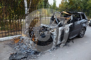 Burnt exploded car. Consequences of disaster or terrorist attack