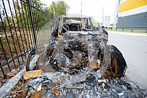 Burnt exploded car. Consequences of disaster or terrorist attack