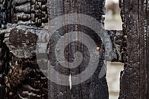 Burnt fence boards after a fire in a private house