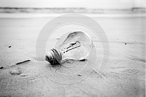 Burnt Light Bulb on a Beach