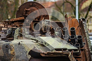 Burnt and melted rusty wreckage of a Soviet Russian-made tank