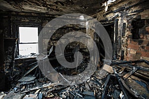 Burnt old house interior. Consequences of fire