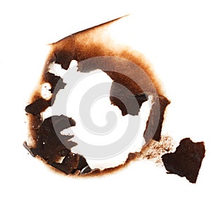 A burnt out circle with a hole in the middle