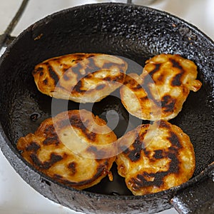 Burnt pancakes in a frying pan