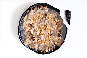 Burnt pizza on white background, fail food