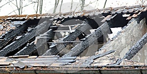 Burnt roof of a old house after fire