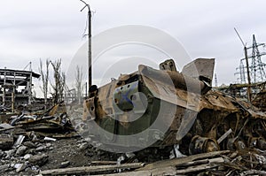 Burnt tank and destroyed buildings of the Azovstal plant shop in Mariupol