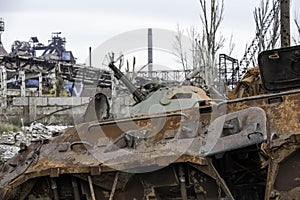 Burnt tank and destroyed buildings of the Azovstal plant shop in Mariupol